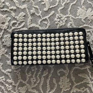 Black snakeskin clutch with pearls